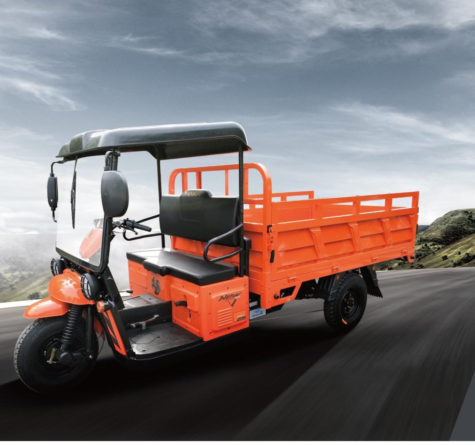 Orange Wanhoo WINTIGER agricultural three-wheeler in side view with an open railed cargo bed and a simple canopy roof over the rider seat