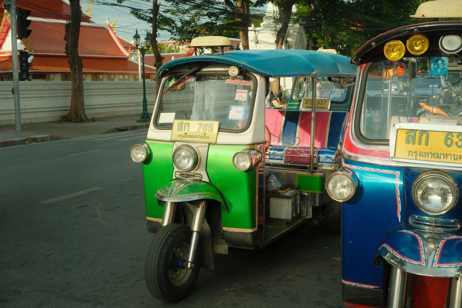 Pexels stock photograph by Gizem Celebi, unaffiliated with Wanhoo, showing rows of three-wheelers on an urban street